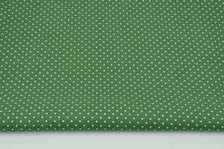 Białe kropki, ciemnozielone tło